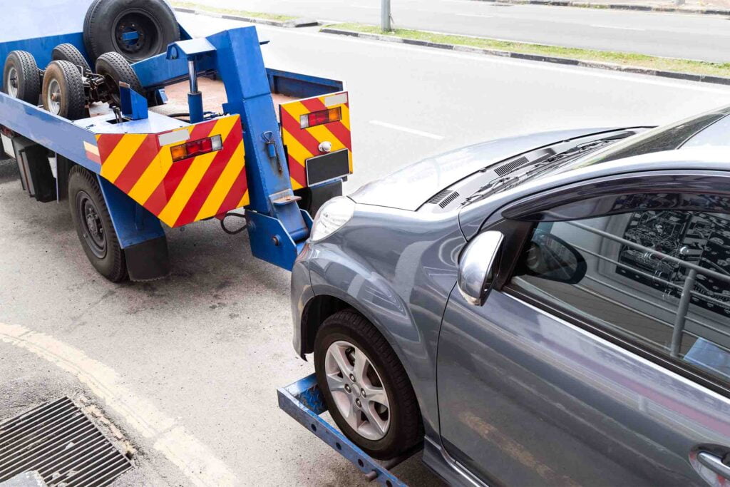 Business vehicle being towed