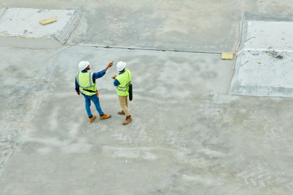 Contractor and subcontractor discussing insurance risks