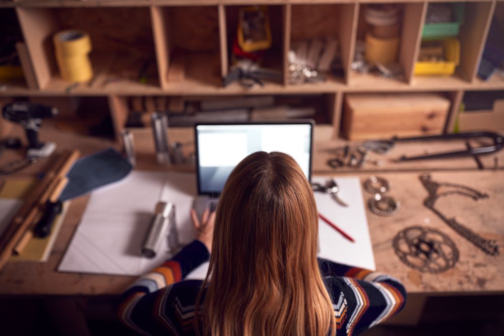 Woman on her computer researching best insurance for sole traders