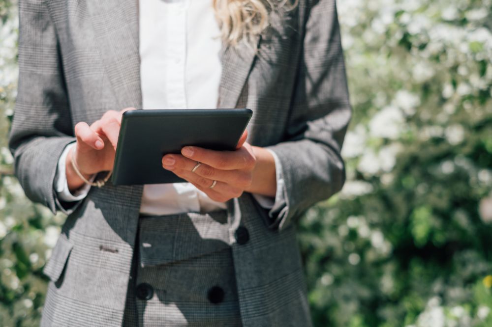 Woman comparing insurance quotes on tablet