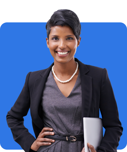 A person in professional attire, wearing a black blazer and gray dress, stands against a blue background holding a laptop and smiling confidently, highlighting the importance of Management Liability Insurance.