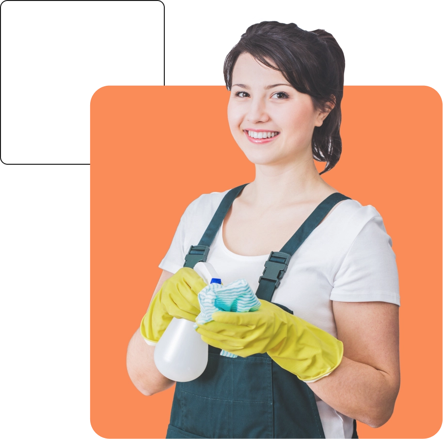 A woman in a white shirt and dark apron, wearing yellow gloves, holding a spray bottle and a cleaning cloth, smiles at the camera with an orange background.