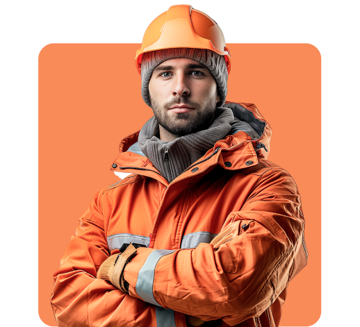 A man wearing protective gear including an orange hard hat, an orange jacket, and gray knit cap poses with arms crossed in front of an orange background.